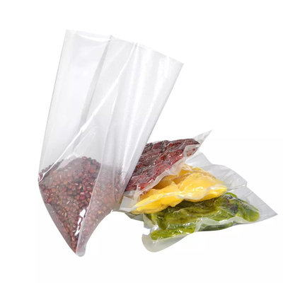 El bolso impreso de encargo del embalaje del vacío del PA PE grabó en relieve bolsos plásticos del almacenamiento del sello de la comida