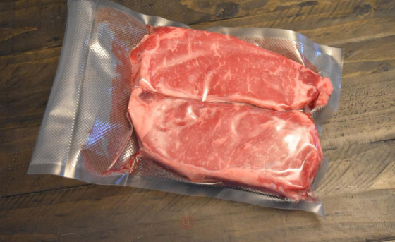 El PE grabó en relieve las bolsas de comida al vacío de las bolsas de comida del sellador al vacío para la carne